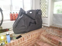 The bike in its bag, ready for train or bus.