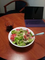 Making your own meals is almost always cheaper than eating out. And often tastes better, too. Here: organic butter lettuce, wild-caught tuna, avocado, tomatoes, olive oil, red wine vinegar, salt and pepper. The wine is a merlot from South Australia.